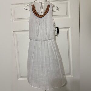 - NWT BY&BY sleeveless white dress. Beads in the front part of the neck.